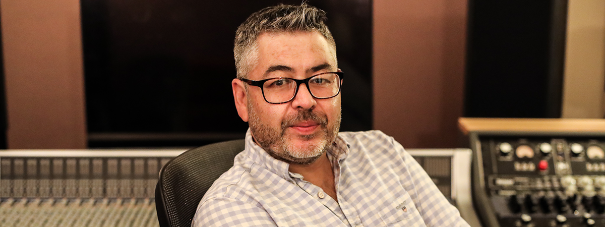 Academic Islah Ali-MacLachlan sat in a recording studio.