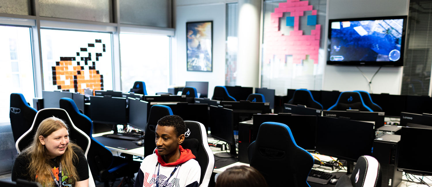 Students using computers in a computer games workshop