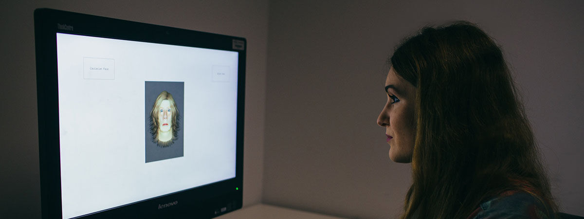 Psychology with Criminology Course Image 1200x450 - Woman with a brain model on a desk