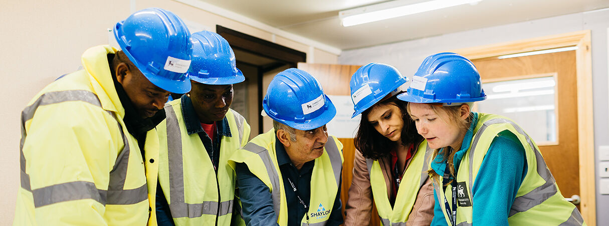 Students in hard hats and hi vis jackets