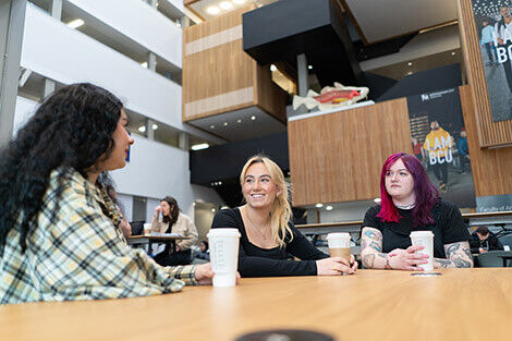 Students chatting over a coffee