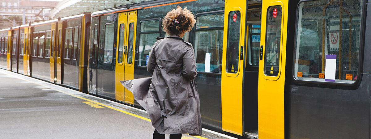 Woman waiting to get onto tram